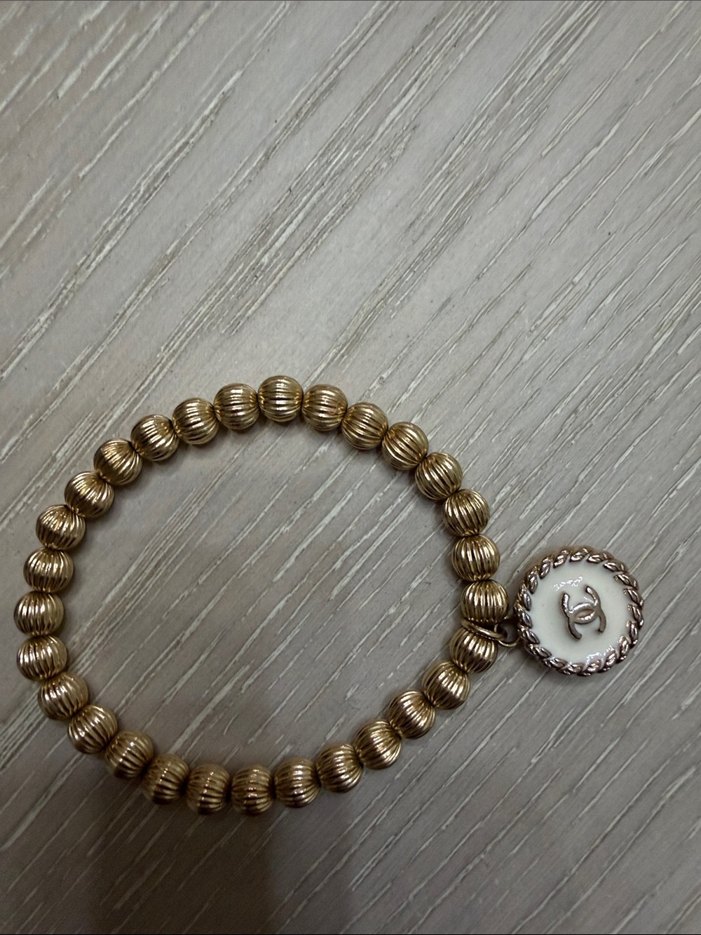 Gold Beaded Bracelet with White Charm - Designer Style